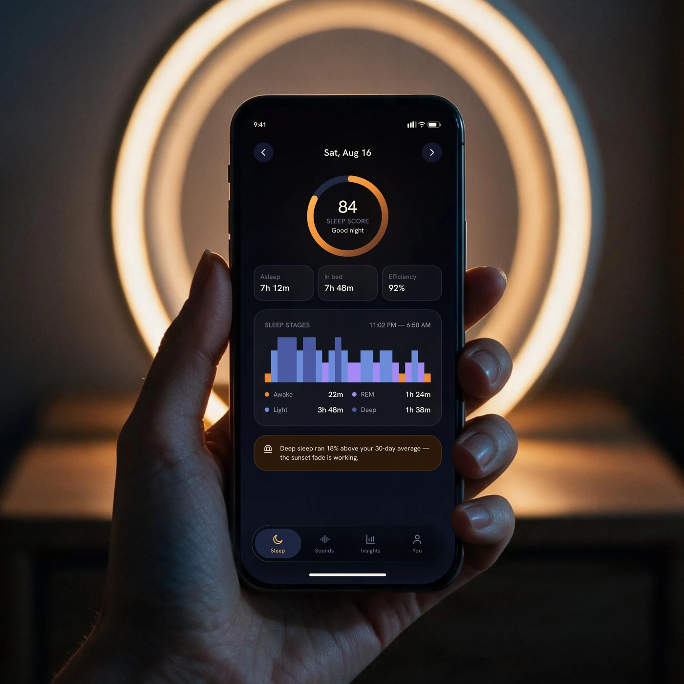 The morning after: last night as one sleep score in the app, the lit ring behind